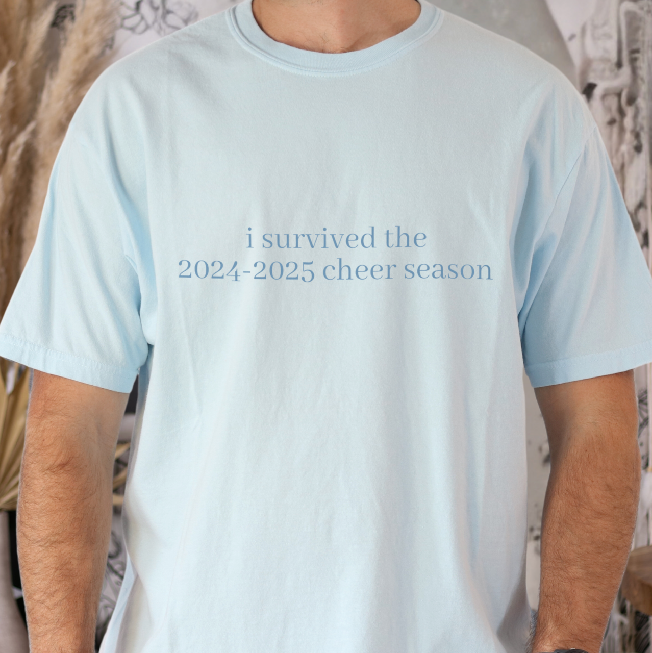 I Survived the 2024-2025 Cheer Season Shirt – Soft Comfort Colors Tee with Tone-on-Tone Design, Funny Cheerleader Gift, Unisex Cheer Coach Shirt