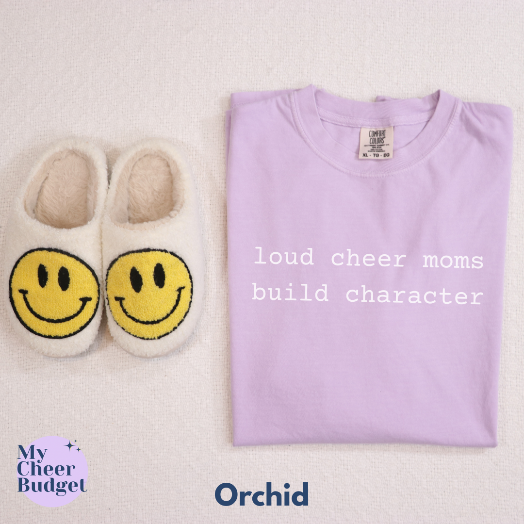 light purple t-shirt with white text 'loud cheer moms build character'