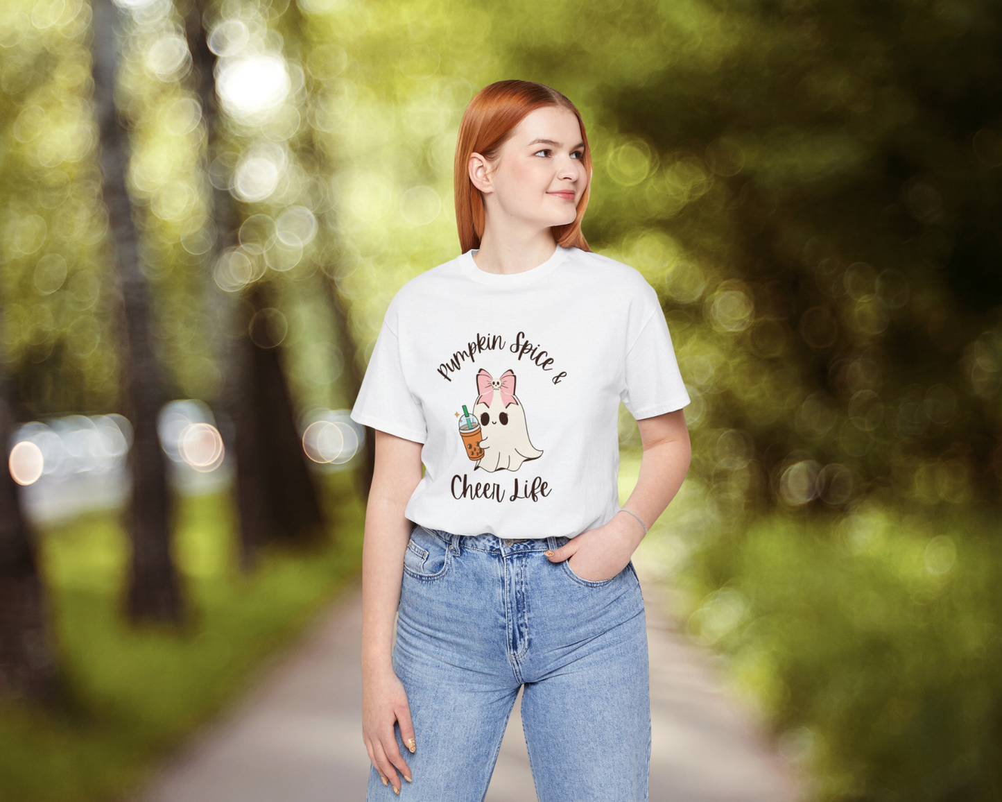 White fall t-shirt with cute Halloween ghost wearing cheer bow carrying a pumpkin spice latte